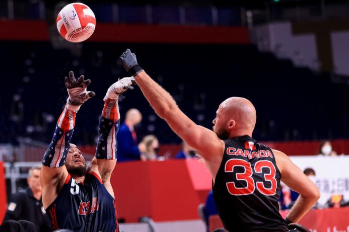 A male wheelchair rugby player in action during the Tokyo 2020 Paralympics.